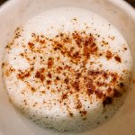 simple holiday eggnog with nutmeg sprinkled on top in a white mug