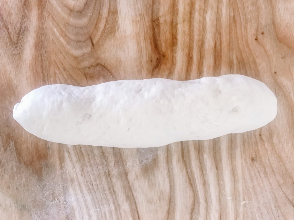 a shaped homemade sourdough sandwich roll