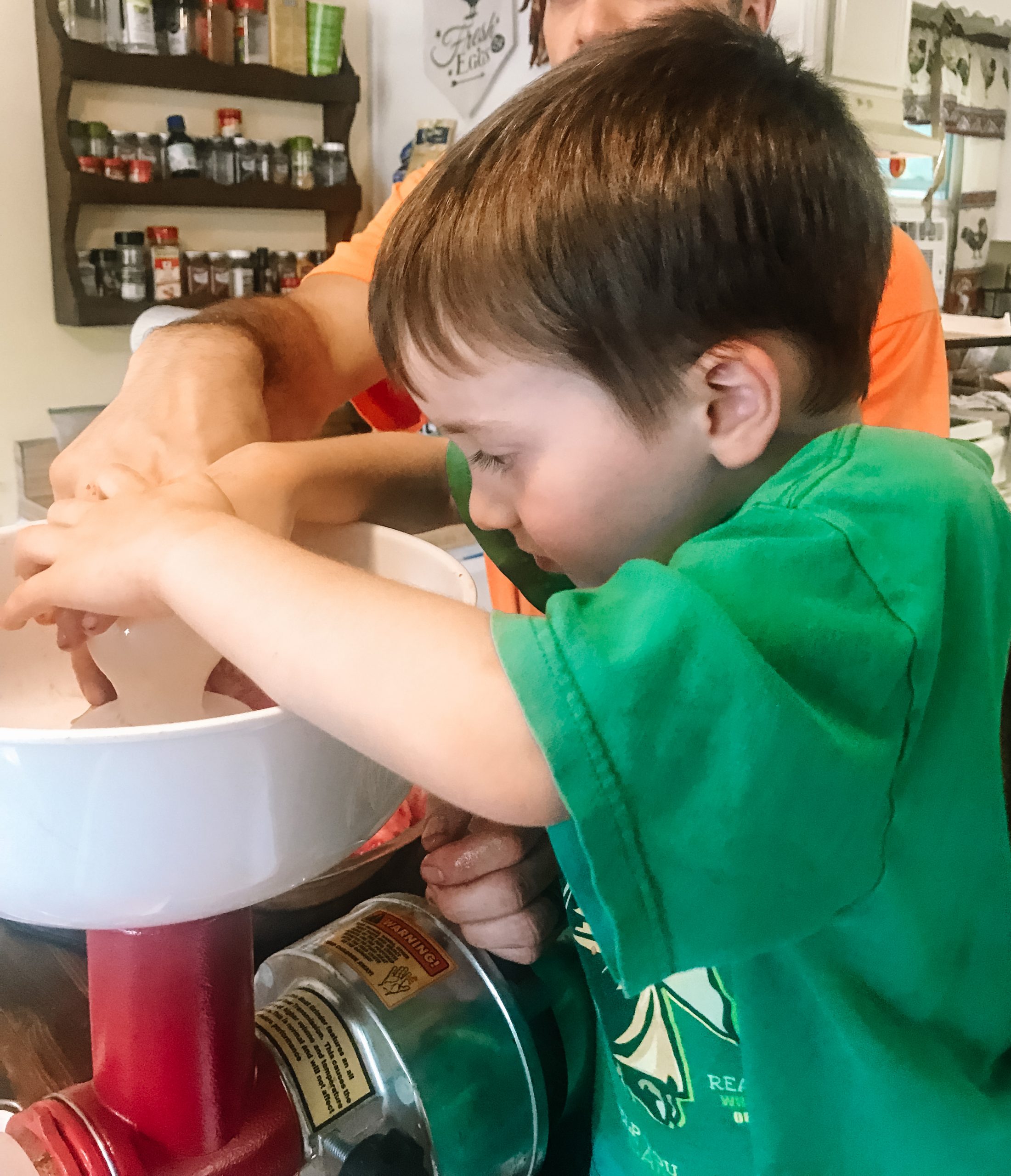 boy helping make tomato sauce