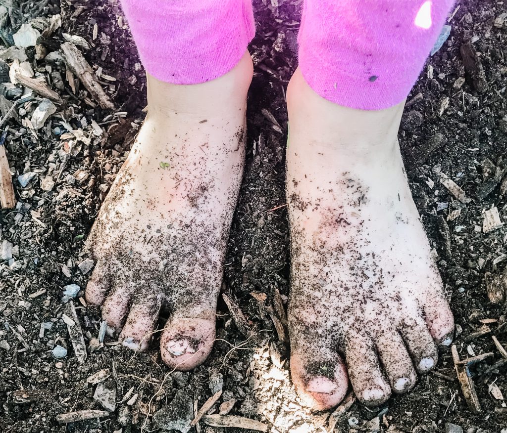 dirty feet from gardening with kids